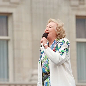 Dame Vera Lynn singing for the crowds gathered at Buckingham Palace for World War II VE