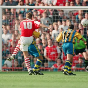 Dennis Bergkamp scores his second goal for his new club Arsenal