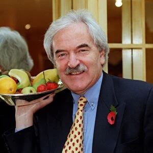 Des Lynam TV Presenter March 98 Holding tray of fruit