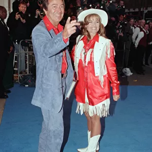Des O Connor and guest arriving at Elton Johns 50th birthday party at