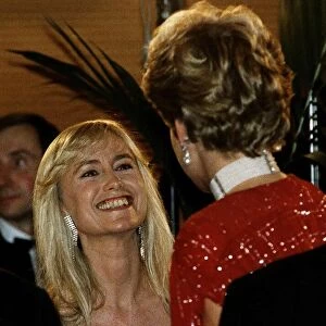 Diana, Princess of Wales talks to actress Susan George as she attends the premiere of