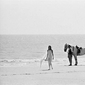 Diana Rigg, who plays Emma Peel, and her white horse on the beach at St Marys Bay