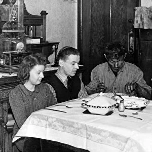 Dinner time for Pitman Tom, at home in Stanley. He is pictured with his wife and children