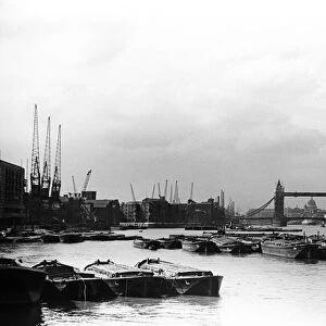 The docks and the River Thames looking towards Tower Bridge and St Pauls Cathedral