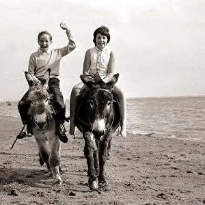 Donkey rides on Exmouth Beach children childhood Holidaymakers