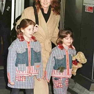Duchess Of York and children Princess Beatrice and Princess Eugenie leave Heathrow for