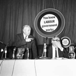 Economics minister George Brown (right) looks surprised as Prime Minister Harold Wilson