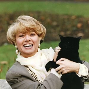 Elaine Paige holding black cat smiling at press call - 09 / 05 / 1992