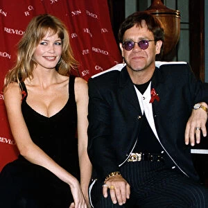 Elton John singer with Claudia Schiffer model