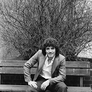 England footballer Kevin Keegan poses for photographers as he performs a joke for them