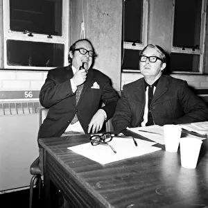 Eric Morecambe and Ernie Wise, working on a script for their show