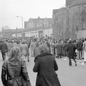Fans queue up outisde The Den, home of Millwall football club