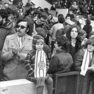 A father and son enjoying themselves in the stands as they got to watch their team Leyton