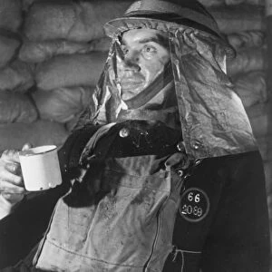 A firefighter takes a well earned break for a cup of tea after attending to many bombed