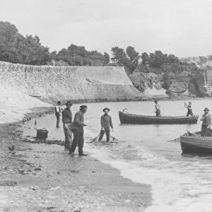 Fishermen launching their seine nets off Livermead beach in 1888