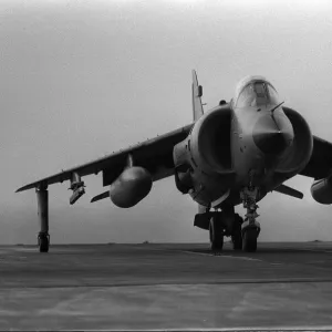 A Fleet Air Arm Sea Harrier prepares to take off from the flight deck of HMS Invincible