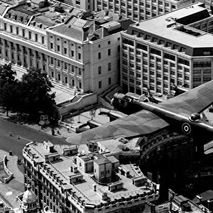 The last flying RAF Lancaster bomber over Admiralty Arch at the start of the mall in