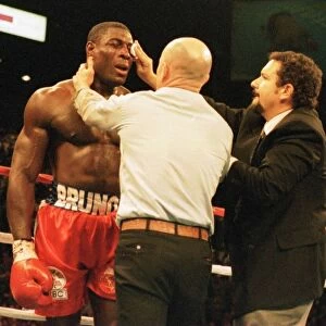Frank Bruno gets attention at the end of the fight after his defeat in three