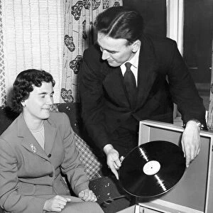 Frank Thompson and his wife, Maureen, listen to a recording of their marriage service