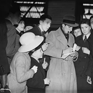 Fred Perry, British Tennis Player, signing autographs. Signing autographs