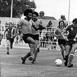 George Berry (left) moves in to challenge City striker Gary Stevens at Ninian Park - 10th