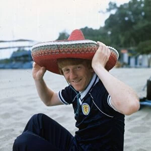 Gordon Strachan wearing a Scotland strip and a sombrero as he relaxes during the 1982
