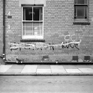 Graffiti covered wall after a football match February 1975 75-01052-013