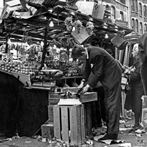 Greengrocers stall in East Street Market, London. circa 1955