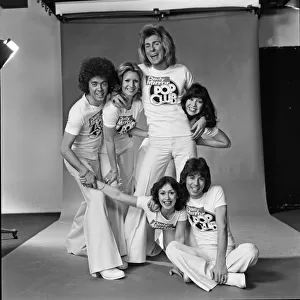 Guys N Dolls pop group wearing Daily Mirror Pop Club T-shirts 29th January 1976