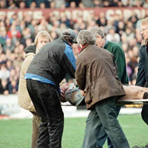 Gwyn Jones (number 7 ) is stretchered off the ground during the Cardiff verses Swansea