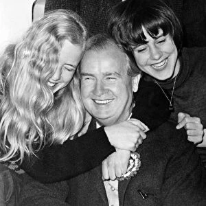 Gwynfor Evans receives a hug from his daughters Meiniri (left) and Branwen (right)