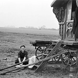 A Gypsy family outside their caravan. May 1947