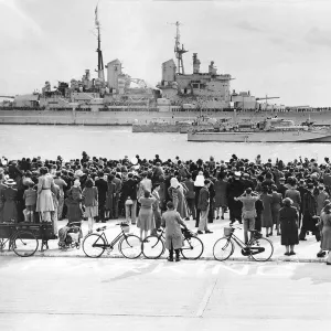 HMS Vanguard which took the Royal Family on their tour of South Africa is escorted back