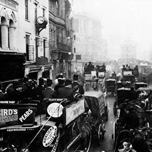 Horse drawn carriages and buses shown in congestion at The Strand, London, November 1908