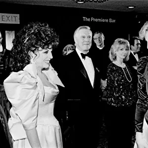 HRH Princess Diana, The Princess of Wales (right) meets actor Joan Collins at the Film