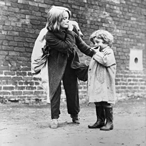 Hull - 19th July 1941. Two little girls pictured leaving the city of Hull
