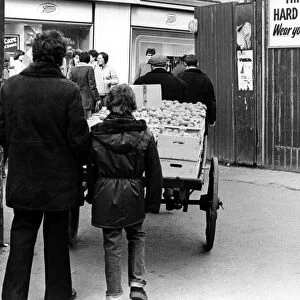 Illegal street trader Kit is on the move to evade police on 31st January 1981
