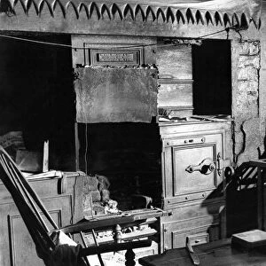 The Interior of slum housing in an area of Newcastle - Mr George Marshall sits in his