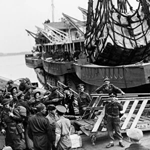 Invasion Day scenes. Canadian troops waiting to go aboard an L. S. I