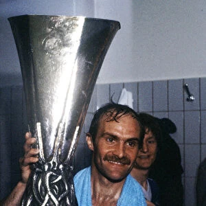 Ipswich Town captain Mick Mills holds aloft the UEFA Cup trophy after his side defeated