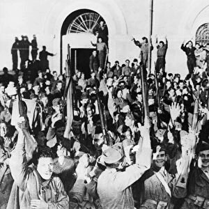 Italian soldiers outside headquarters in Southern Italy cheer the declaration of war