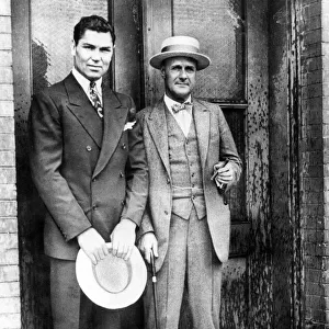 Jack Dempsey (left) with boxing promoter Tex Rickard. 1927