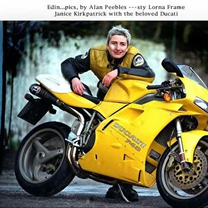 Janice Kirkpatrick top designer with her yellow Ducati 748 motorcycle