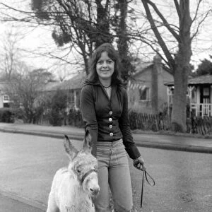 Jean Wooler walking "Misty"the donkey. January 1975 75-00591-006