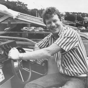 Jim Davidson at the wheel of his Princess boat on Torquay Marina20th July1987