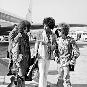 Jimi Hendrix arrives with members of his band "The Jimi Hendrix Experience"