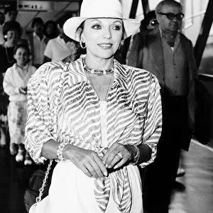 Joan Collins Actress arrives at Heathrow Airport from Nice France A©Mirrorpix