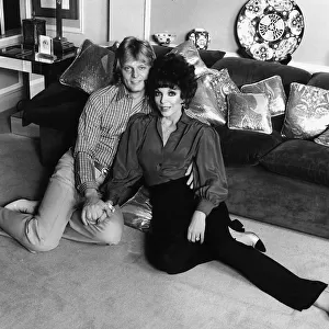 Joan Collins Actress with her Swedish playboy husband Peter Holm December 1983