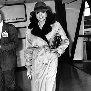 Joan Collins actress trys to sneak off to Paris, April 1988