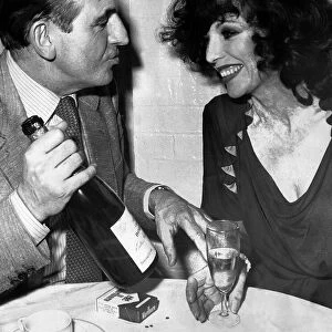 Joan Collins during dinner with David Lewin at a Neal Street restaurant in London